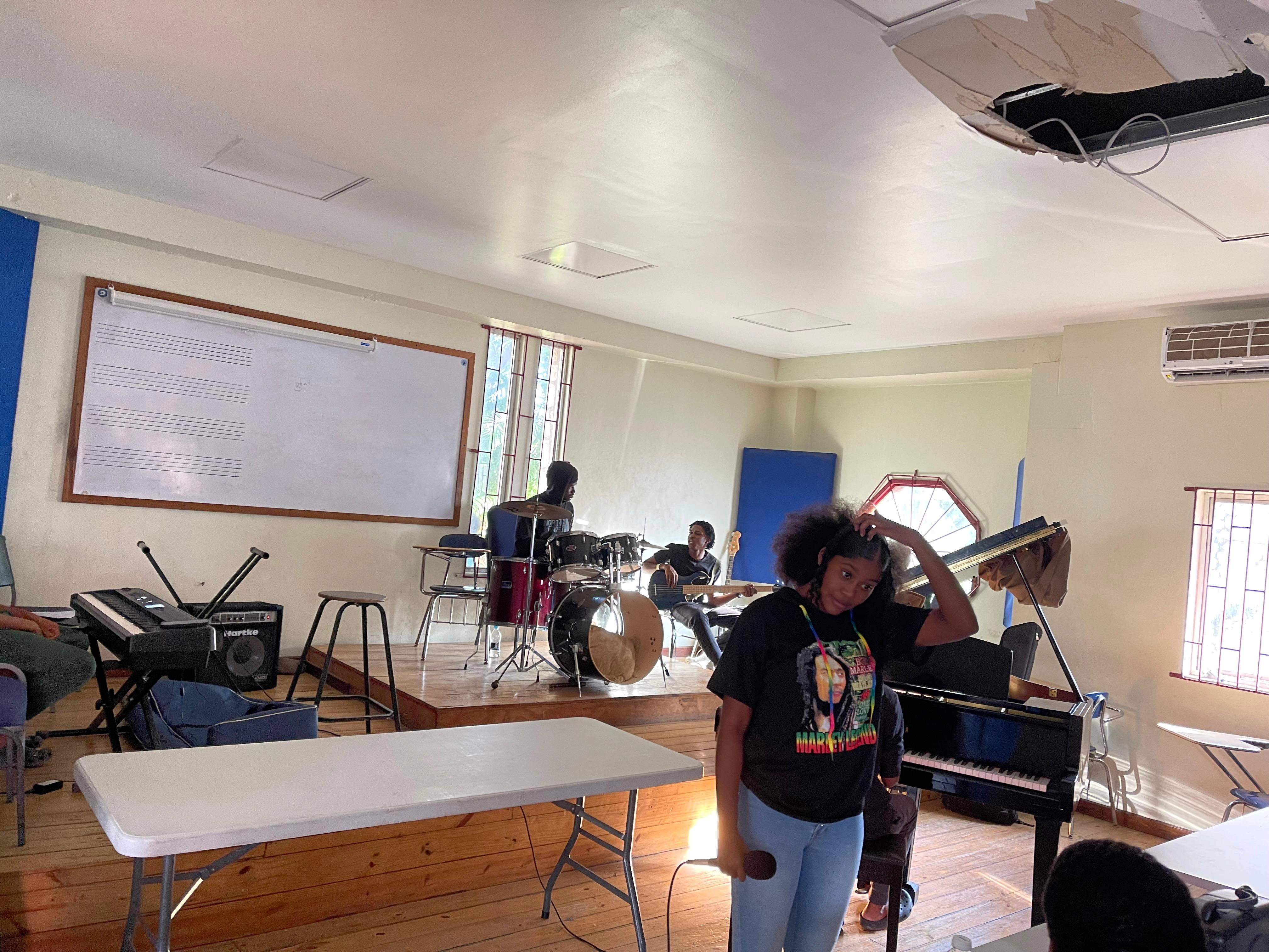 Mesh Marina rehearsing for a live performance in studio